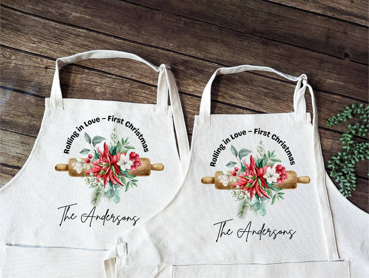 Personalized Couple Christmas Apron Set – “Rolling in Love” First Christmas Aprons with Floral Rolling Pin Design, Newlywed Baking Gift