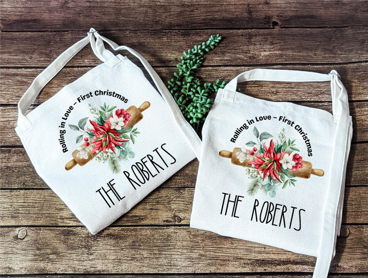 Personalized Couple Christmas Apron Set – “Rolling in Love” First Christmas Aprons with Floral Rolling Pin Design, Newlywed Baking Gift